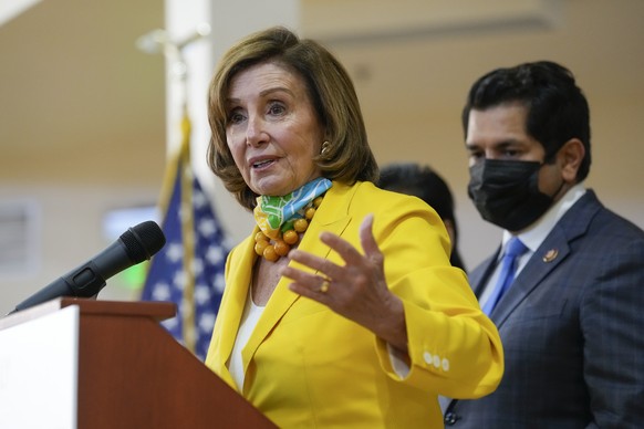 Speaker of the House Nancy Pelosi, left, and U.S. Congressman Jimmy Gomez, right, hold a press conference about the new Child Tax Credit Thursday, July 15, 2021, in Los Angeles. The program provides c ...