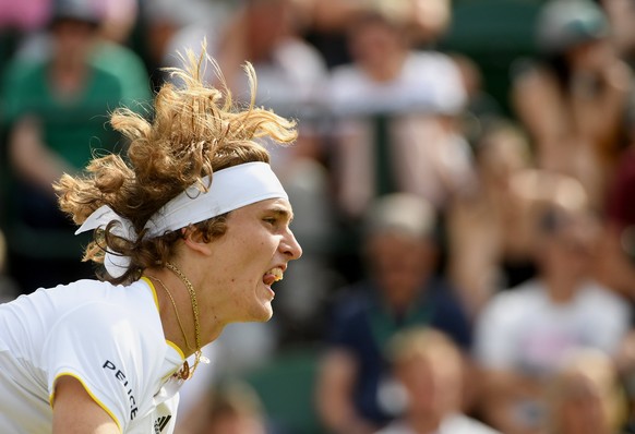 epa06065890 Alexander Zverev of Germany in action against Evgeny Donskoy of Russia during their first round match for the Wimbledon Championships at the All England Lawn Tennis Club, in London, Britai ...