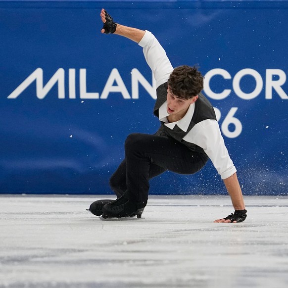 Lukas Britschgi of Switzerland falls during the men's figure skating short program at the 2026 Winter Olympics, in Milan, Italy, Tuesday, Feb. 10, 2026. (AP Photo/Ashley Landis)
Lukas Britschgi