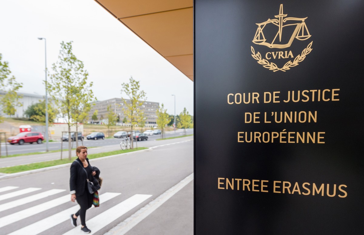 In this photo taken on Monday, Oct. 5, 2015 a woman walks by the entrance to the European Court of Justice in Luxembourg. Europe's highest court has ruled in favor of an Austrian law student who  ...