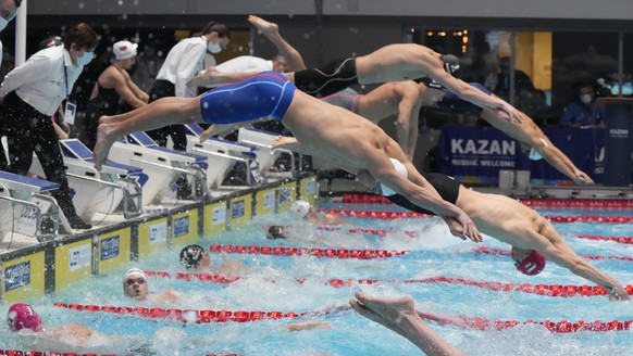 Swimmers dive in during the Mixed - 4 X 50m Freestyle Final at the European Short Course Swimming Championships at the Aquatics Palace in Kazan in Russia, Saturday, Nov. 6, 2021. (AP Photo/Sergei Grit ...