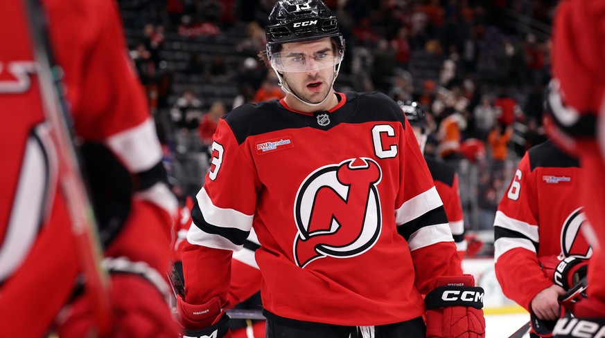 New Jersey Devils center Nico Hischier (13) skates off the ice after the Devils lost to the Philadelphia Flyers in an NHL hockey game Tuesday, April 7, 2026, in Newark, N.J. (AP Photo/Adam Hunger)
Nic ...