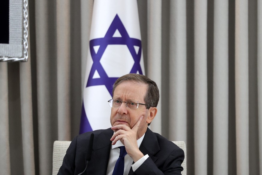 epa12575440 Israeli President Isaac Herzog looks on during a meeting with the German Chancellor Friedrich Merz (not pictured) at the President&#039;s residence in Jerusalem, 06 December 2025. EPA/ABIR ...