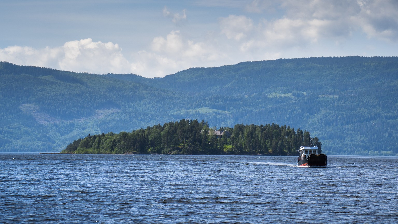 epa09356258 (FILE) - A boat transports people and goods to and from the island Utoya, in Tyrifjorden in Hole municipality, Norway, 17 June 2021 (reissued 21 July 2021). Norway marks 10 years since 22  ...