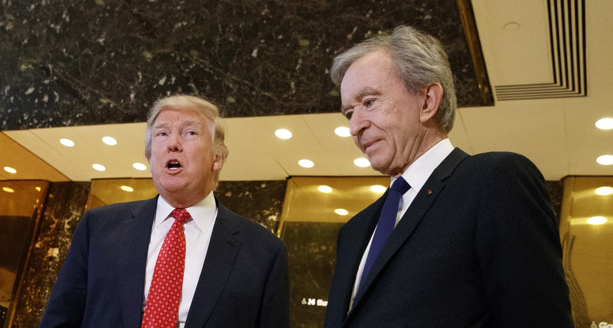 President-elect Donald Trump, accompanied by French businessman Bernard Arnault, speaks with reporters after a meeting at Trump Tower in New York, Monday, Jan. 9, 2017. (AP Photo/Evan Vucci)