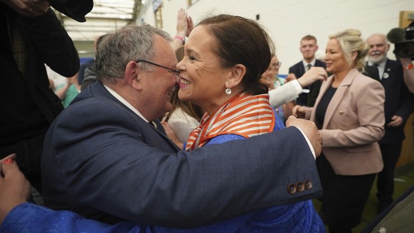 Sinn Fein leader Mary Lou McDonald, center, and Michelle O&#039;Neill, right, arrive at the Northern Ireland Assembly Election count centre at Meadowbank Sports arena in Magherafelt, Northern Ireland, ...