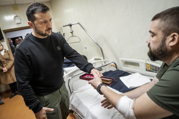 Ukraine&#039;s President Volodymyr Zelenskyy, left, awards honor medals to soldiers during his visit to a military hospital in Kyiv, Ukraine, Tuesday, Nov. 19, 2024. (Mads Claus Rasmussen/Ritzau Scanp ...