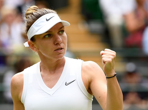 epa07703531 Simona Halep of Romania in action against Cori Gauff of the USA during their fourth round match for the Wimbledon Championships at the All England Lawn Tennis Club, in London, Britain, 08  ...