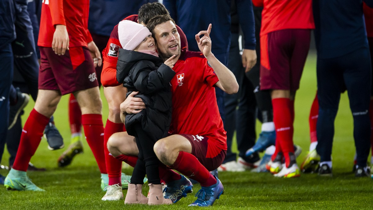 Switzerland's soccer players with Fabian Frei celebrate after directly qualifying for the FIFA World Cup Qatar 2022 during the 2022 FIFA World Cup European Qualifying Group C match between Switze ...