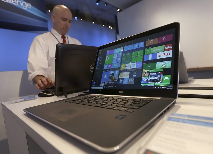 FILE - In this April 29, 2015 file photo, a Dell laptop computer running Windows 10 is on display at the Microsoft Build conference in San Francisco. Microsofts new Windows 10 operating system debuts ...