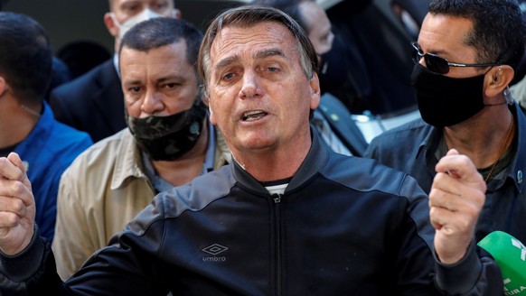 epa09351993 Brazilian President Jair Bolsonaro delivers remarks after he was discharged from Vila Nova Star Hospital, in Sao Paulo, Brazil, 18 July 2021. Bolsonaro was admitted to the Armed Forces Hos ...