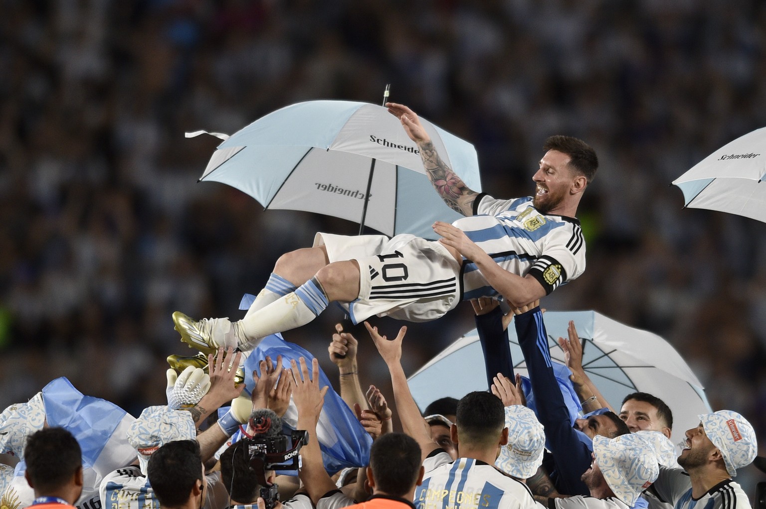 Teammates lift up Argentina&#039;s Lionel Messi during a celebration ceremony for the World Cup winners after an international friendly soccer match against Panama in Buenos Aires, Argentina, Thursday ...