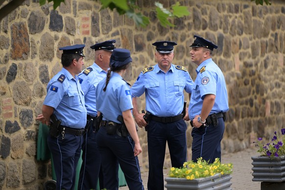 epa10715433 Kosovo police officers patrol in front of the Gracanica monastery during the Vidovdan celebrations (Saint Vitus day) in Gracanica, Kosovo, 28 June 2023. The Serbian Orthodox Church designa ...