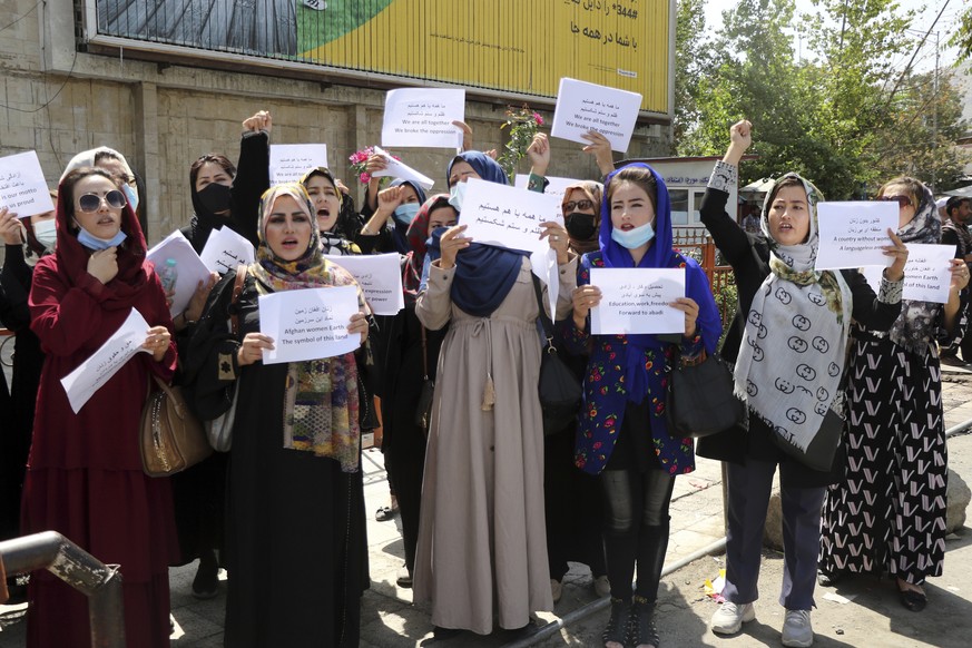 Women gather to demand their rights under the Taliban rule during a protest in Kabul, Afghanistan, Friday, Sept. 3, 2021. As the world watches intently for clues on how the Taliban will govern, their  ...