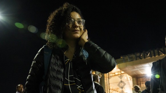 Sanaa Seif, sister of Egypt&#039;s jailed leading pro-democracy activist Alaa Abdel-Fattah, who is on a hunger and water strike, leaves the Sharm El Sheikh International Airport shortly after arriving ...