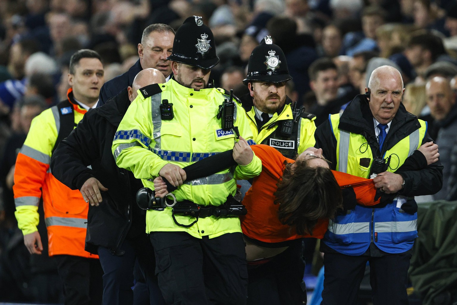 Liverpool, England, 17th March 2022. A protester attaches himself to the goal posts during the Premier League match at Goodison Park, Liverpool. Picture credit should read: Darren Staples / Sportimage ...