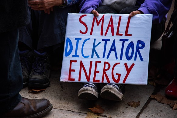 September 17, 2025, London, England, United Kingdom: A protestor holds a placard during the Trump not welcome demonstration at Parliament Square. Around 50 protest groups were expected to gather toget ...