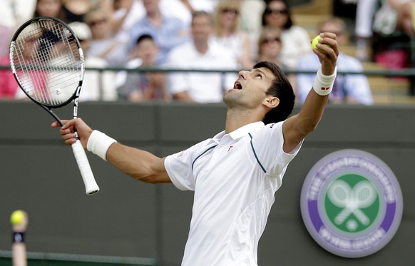 Novak Djokovic of Serbia reacts during his match against Kevin Anderson of South Africa at the Wimbledon Tennis Championships in London, July 7, 2015. REUTERS/Henry Browne