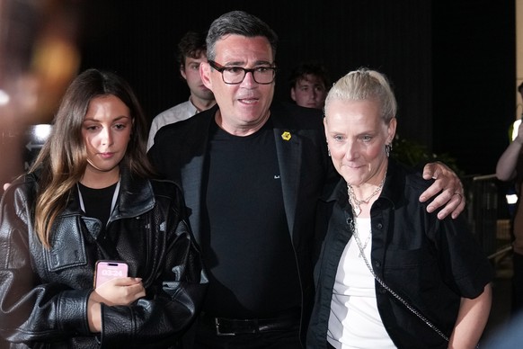 FILE - Britain's Labour party's Andy Burnham leaves with his wife Marie-France Van Heel and their daughter Rosie after winning the Makerfield by-election, paving the way for a leadership cha ...