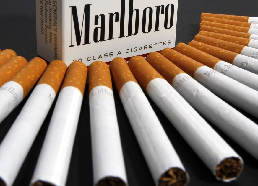 FILE - In this July 17, 2012 file photo, Marlboro cigarettes are displayed in Montpelier, Vt. Philip Morris and Altria have ended merger talks and JUULÄôs CEO is stepping down from the top post as cr ...