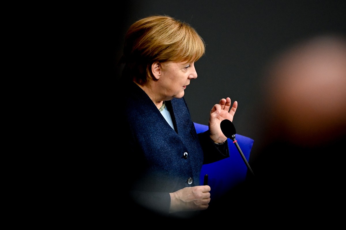 epa08887422 German Chancellor Angela Merkel answers questions from Members of Parliament (MPs) during a questions and answer session at the German Parliament Bundestag in Berlin, Germany, 16 December  ...