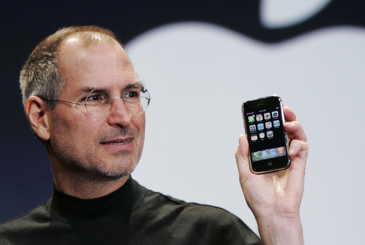 FILE- Apple CEO Steve Jobs holds up an Apple iPhone at the MacWorld Conference in San Francisco, in this Jan. 9, 2007 file photo.. (AP Photo/Paul Sakuma, File)
OpenAI-Jony Ive