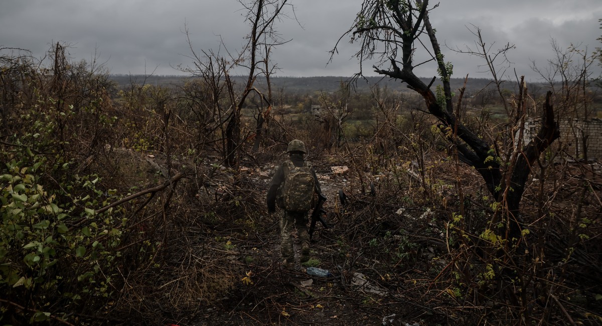 In this photo taken on Oct. 25, 2025 and provided by Ukraine's 24th Mechanised Brigade press service, a serviceman walks at the front line, amid Russia's attack on Ukraine, near the frontlin ...