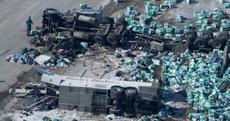 This aerial photo shows the wreckage of a fatal crash outside of Tisdale, Saskatchewan on Saturday, April, 7, 2018. Canadian police said that several people were killed and others injured after a truc ...