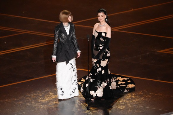 Anna Wintour, left, and Anne Hathaway present the award for best costume design during the Oscars on Sunday, March 15, 2026, at the Dolby Theatre in Los Angeles. (AP Photo/Chris Pizzello)
Anna Wintour ...