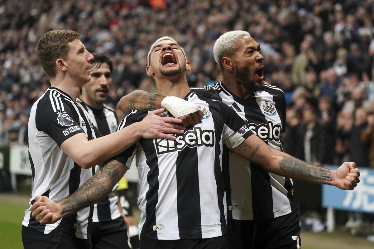Newcastle United's Bruno Guimaraes, centre, celebrates scoring his side's third goal of the game only to see it ruled out by VAR , during the English Premier League soccer match between Newc ...