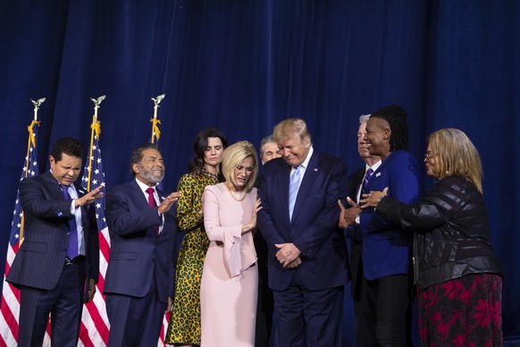 FILE - In this Jan. 3, 2020 file photo, faith leaders pray over President Donald Trump during an &quot;Evangelicals for Trump Coalition Launch&quot; at King Jesus International Ministry in Miami. On S ...