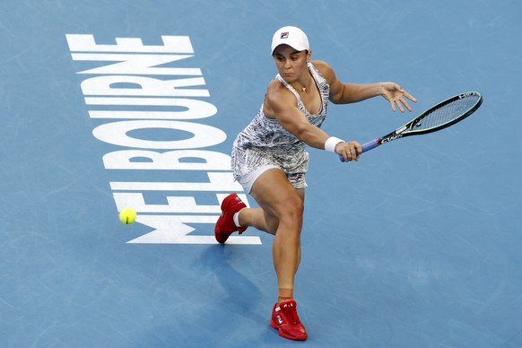 Ash Barty of Australia plays a backhand return to Jessica Pegula of the U.S. during their quarterfinal match at the Australian Open tennis championships in Melbourne, Australia, Tuesday, Jan. 25, 2022. (AP Photo/Tertius Pickard)
Ash Barty