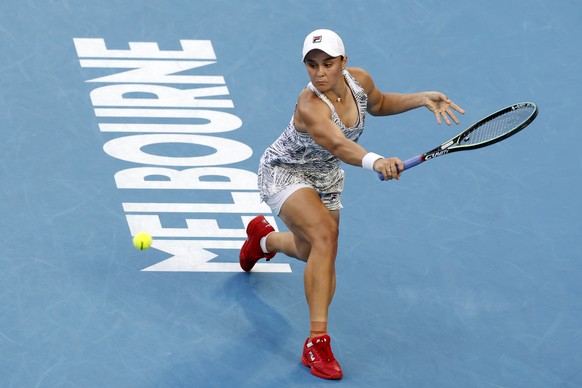 Ash Barty of Australia plays a backhand return to Jessica Pegula of the U.S. during their quarterfinal match at the Australian Open tennis championships in Melbourne, Australia, Tuesday, Jan. 25, 2022 ...