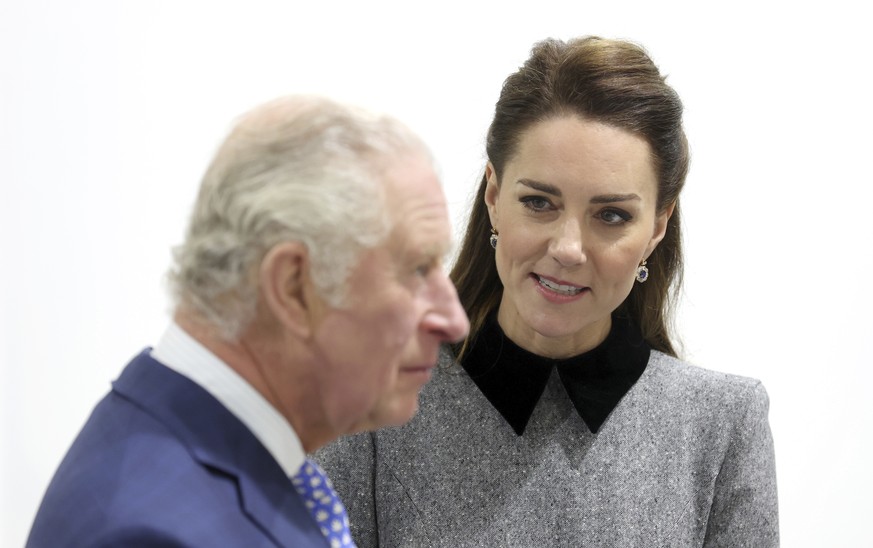 FILE - Britain&#039;s Prince Charles and Kate, Duchess of Cambridge during their visit to The Prince&#039;s Foundation training site for arts and culture at Trinity Buoy Wharf in London, England, Thur ...