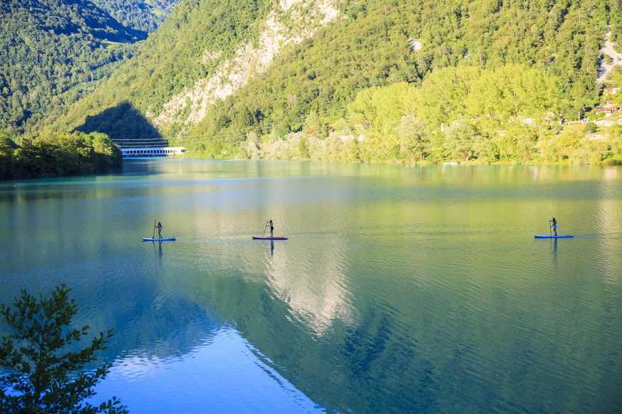 epaselect epa06092272 Stand up paddle boarders make their way on River Isonzo at Most na Soci, in Slovenia, 16 July 2017 (issued 17 July 2017) The Isonzo or Soca is a 138-kilometre long river that flo ...