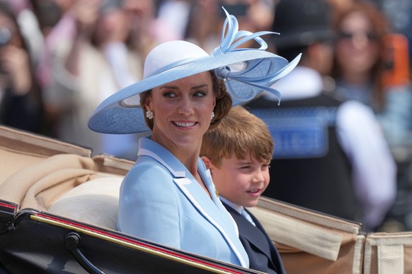 Kate Princess of Wales with Prince Louis ride in an open top carriage during Trooping The Colour, the King's annual birthday parade, in London, Saturday, June 13, 2026. (AP Photo/Kirsty Wiggleswo ...