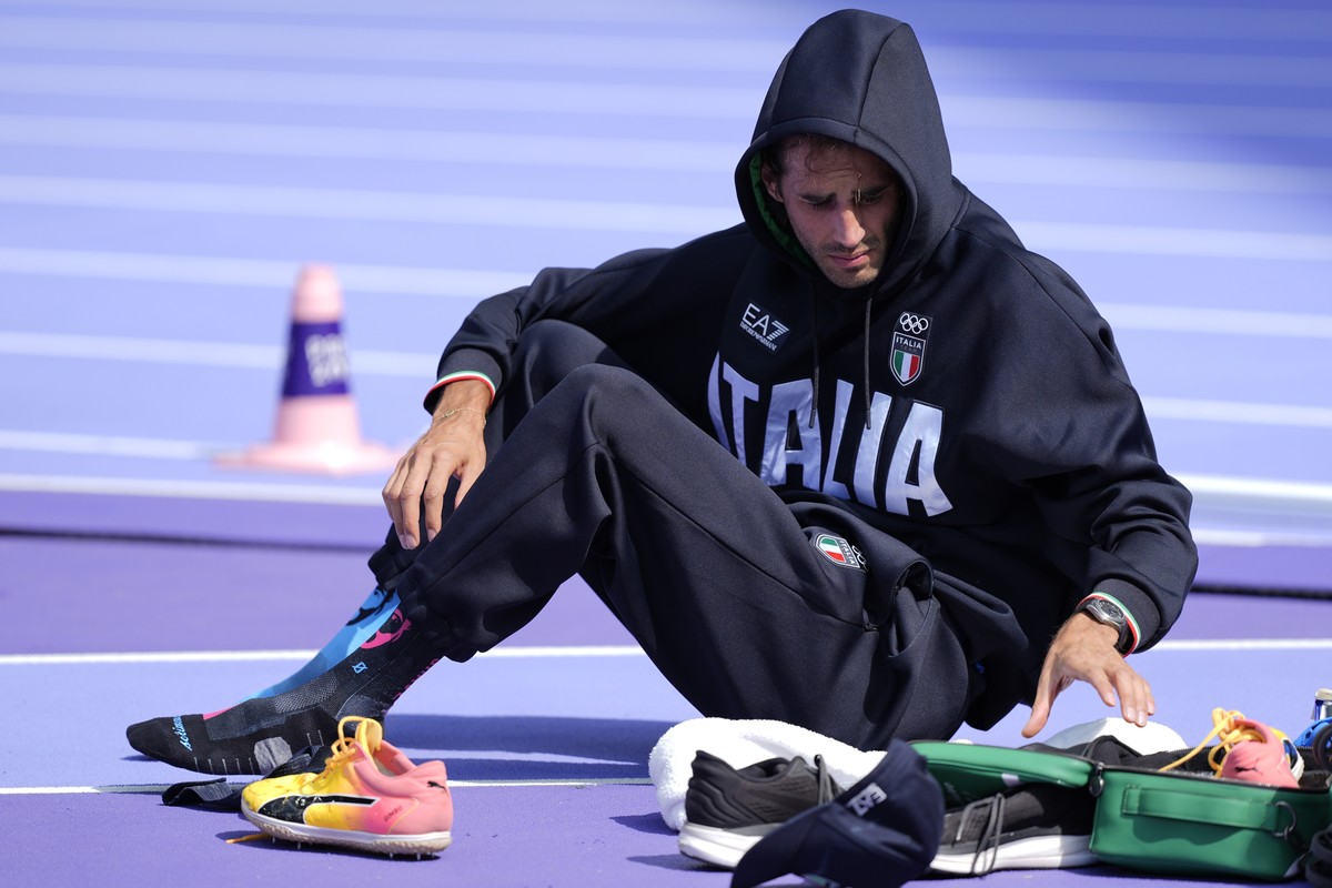 Gianmarco Tamberi, of Italy, sits during the men's high jump qualification at the 2024 Summer Olympics, Wednesday, Aug. 7, 2024, in Saint-Denis, France. (AP Photo/Matthias Schrader)