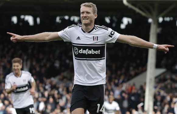 Fulham&#039;s Andre Schuerrle celebrates scoring his side&#039;s first goal during the English Premier League soccer match between Fulham and Arsenal at Craven Cottage stadium in London, Sunday, Oct.  ...