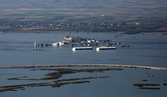 epa10902059 An aerial view shows flooded agricultural lands and facilities in the Thessalian plain, Greece, 05 October 2023. European Commissioner for Agriculture Janusz Wojciechowski visited areas of ...