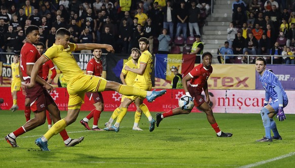 epa11660821 Romania&#039;s Cristian Ignat (L) in action against Switzerland goalkeeper Marvin Keller (R) during the 2025 UEFA European Under-21 Championship qualifier soccer match between Romania and  ...