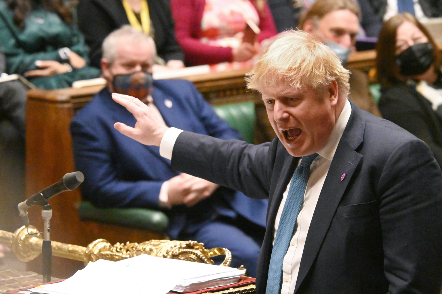 epa09710654 A handout photograph released by the UK Parliament shows British Prime Minister Boris Johnson speaking during the Prime Minister&#039;s Questions (PMQs) at the House of Commons in London,  ...