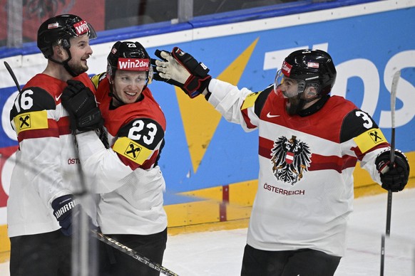 L-R Dominic Zwerger, Marco Rossi and Peter Schneider all AUT celebrate a goal during the 2024 IIHF World Championship, WM, Weltmeisterschaft group A, match Canada vs Austria, in Prague, Czech Republic ...