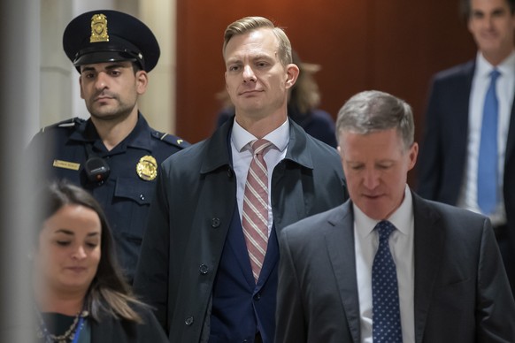 epa08000493 David Holmes (C), a US State Department official who reportedly overheard President Donald Trump's phone call on Ukraine, arrives for his deposition for the US House of Representative ...