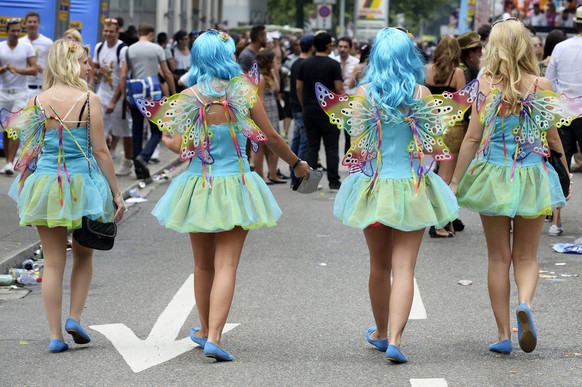 epa04338935 Participants of the annual Street Parade wearing fancy costumes celebrate in the city center of Zurich, Switzerland, 02 August 2014. Hundreds of thousands of ravers participate in the even ...