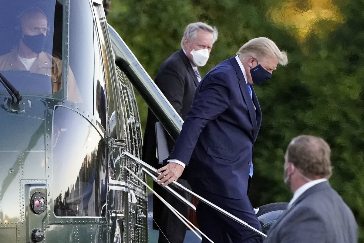 President Donald Trump arrives at Walter Reed National Military Medical Center, in Bethesda, Md., Friday, Oct. 2, 2020, on Marine One helicopter after he tested positive for COVID-19. White House chie ...