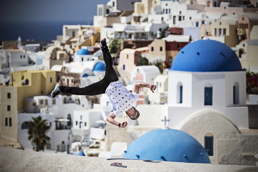 epa04428295 A handout picture made available by Global Newsroom on 02 October 2014 of Corry de Mayers from the USA performing during the preshoot at Oia area on the island of Santorini, Greece, 02 Oct ...