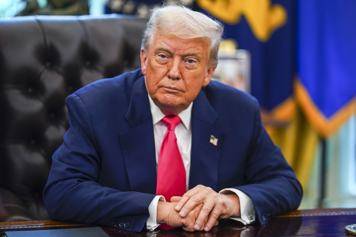 epa12300754 US President Donald Trump looks on during an event marking the 90th anniversary of the Social Security Act, in the Oval Office at the White House, Washington, DC, USA, 14 August 2025. Pres ...