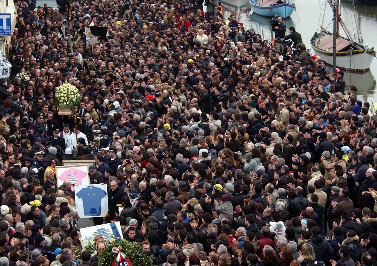 The coffin of Italian cycling legend and former Tour de France and Giro d'Italia race winner Marco Pantani is carried outside the San Giacomo church in Cesenatico, northern Italy, Wednesday, Feb. ...