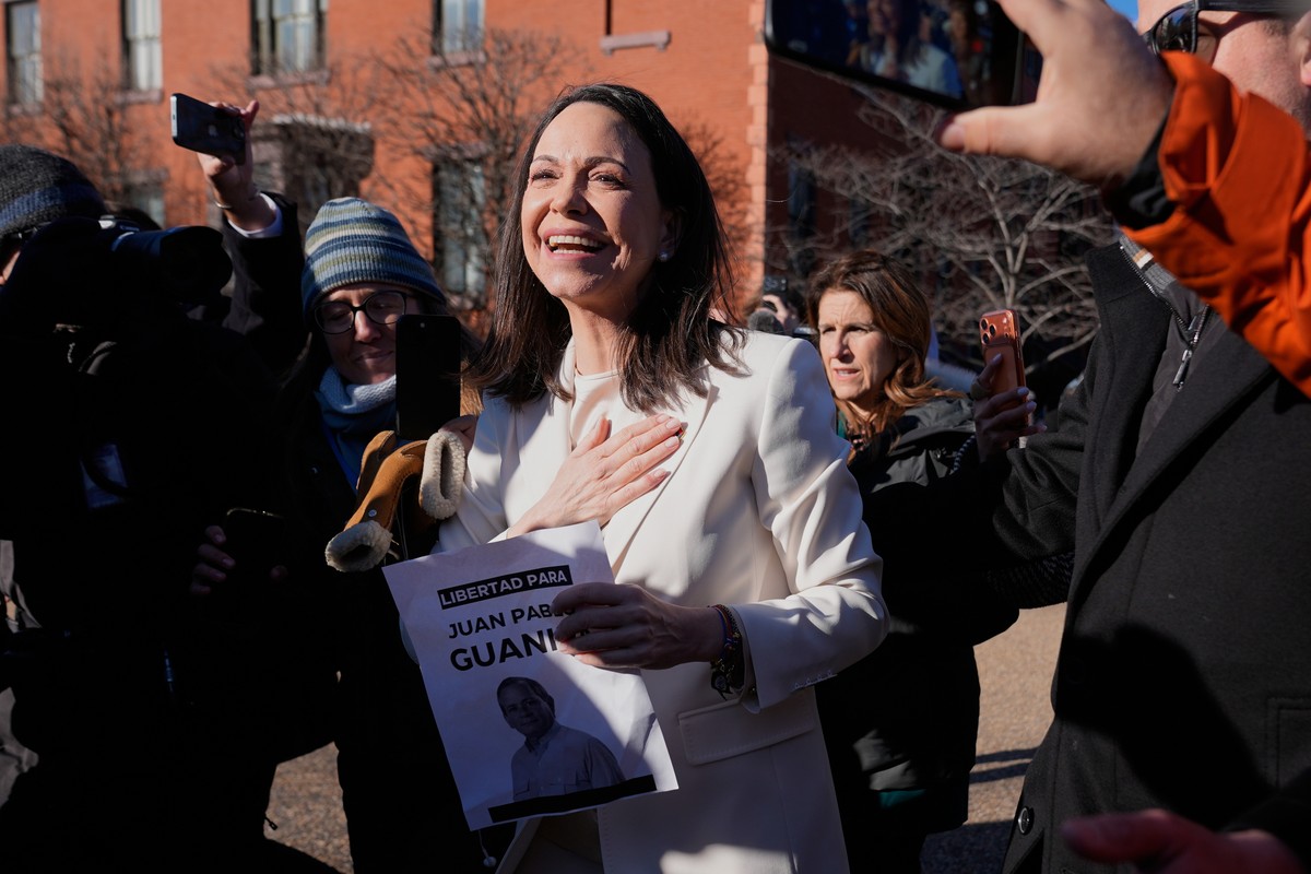 Venezuelan opposition leader MarÌa Corina Machado greets supporters on Pennsylvania Avenue near the White House after meeting with President Donald Trump, Thursday, Jan. 15, 2026, in Washington. (AP P ...