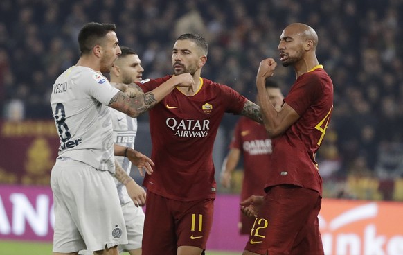 Roma&#039;s Steven Nzonzi, right, argues with Inter Milan&#039;s Matias Vecino, left, during the Serie A soccer match between Roma and Inter Milan at the Rome Olympic stadium, Monday, Dec. 3, 2018. (A ...